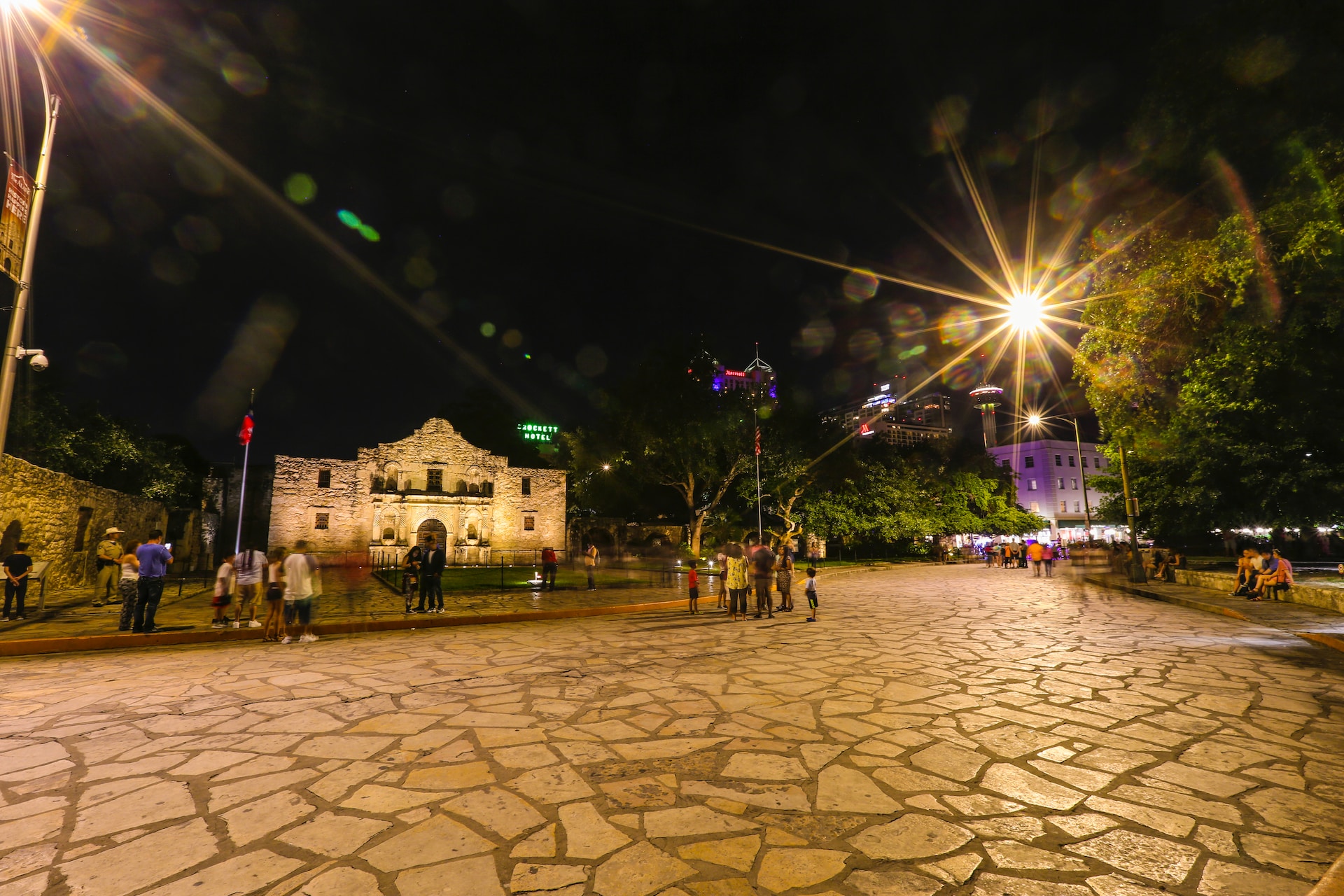 The Alamo and grounds at night.