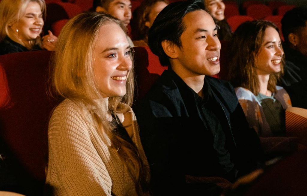 movie patrons enjoying a film at a theater